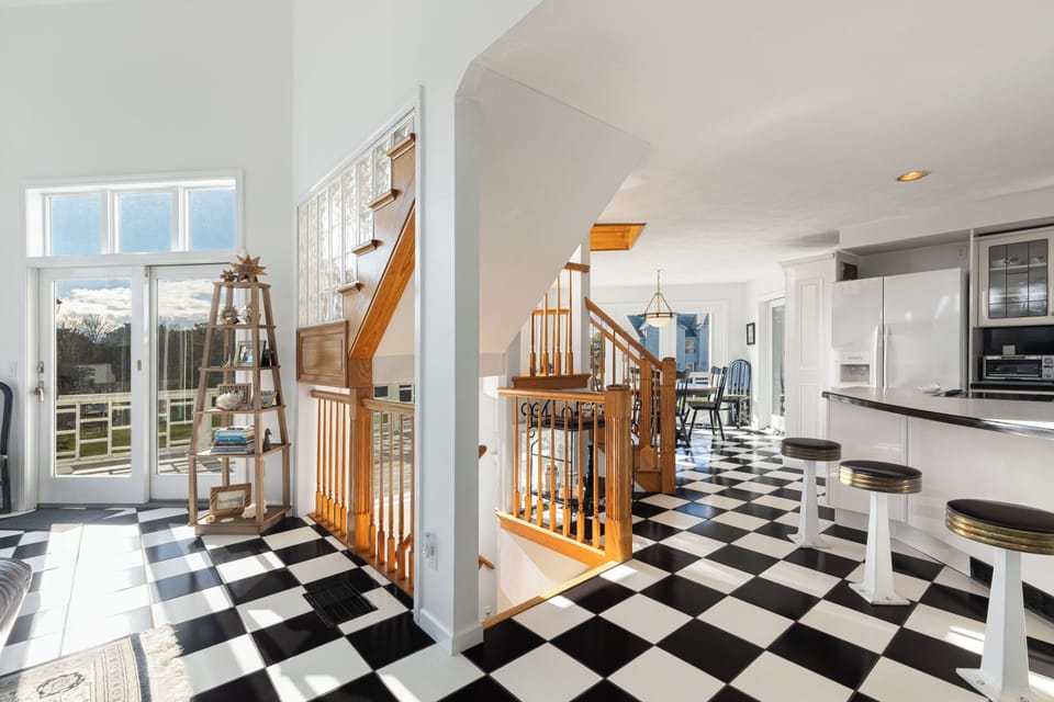 Second floor: kitchen with open floor plan + wrap around deck