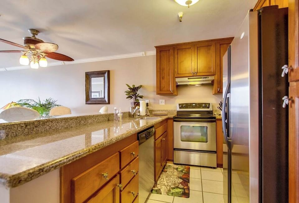 Kitchen with an oven, blender, refrigerator, recessed lighting, microwave, sink, toaster, coffee, stainless steel appliances