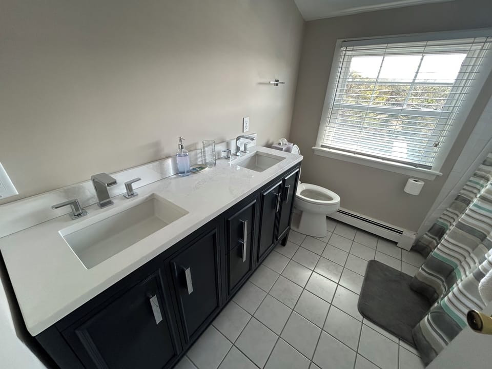 2nd floor  bath newly renovated. Custom mirror installed soon. New fixtures. 