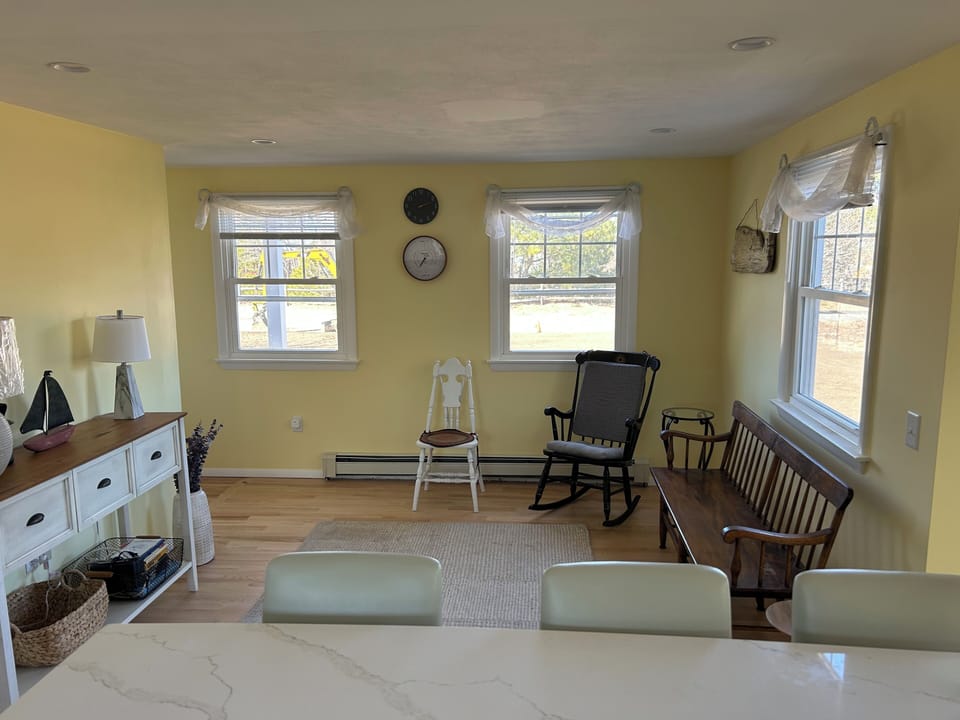 Front entrance/foyer/mud room seating area. Three Island stools.