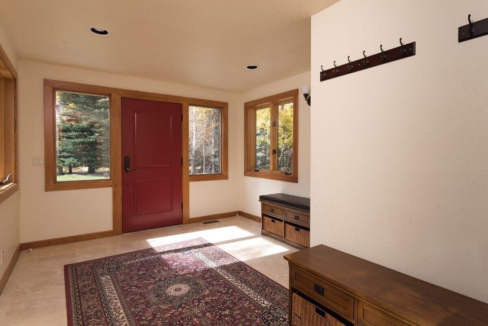 Large foyer with storage and coat racks
