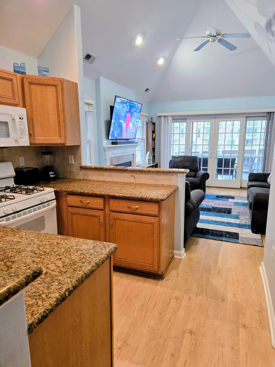 Kitchen facing living room and deck