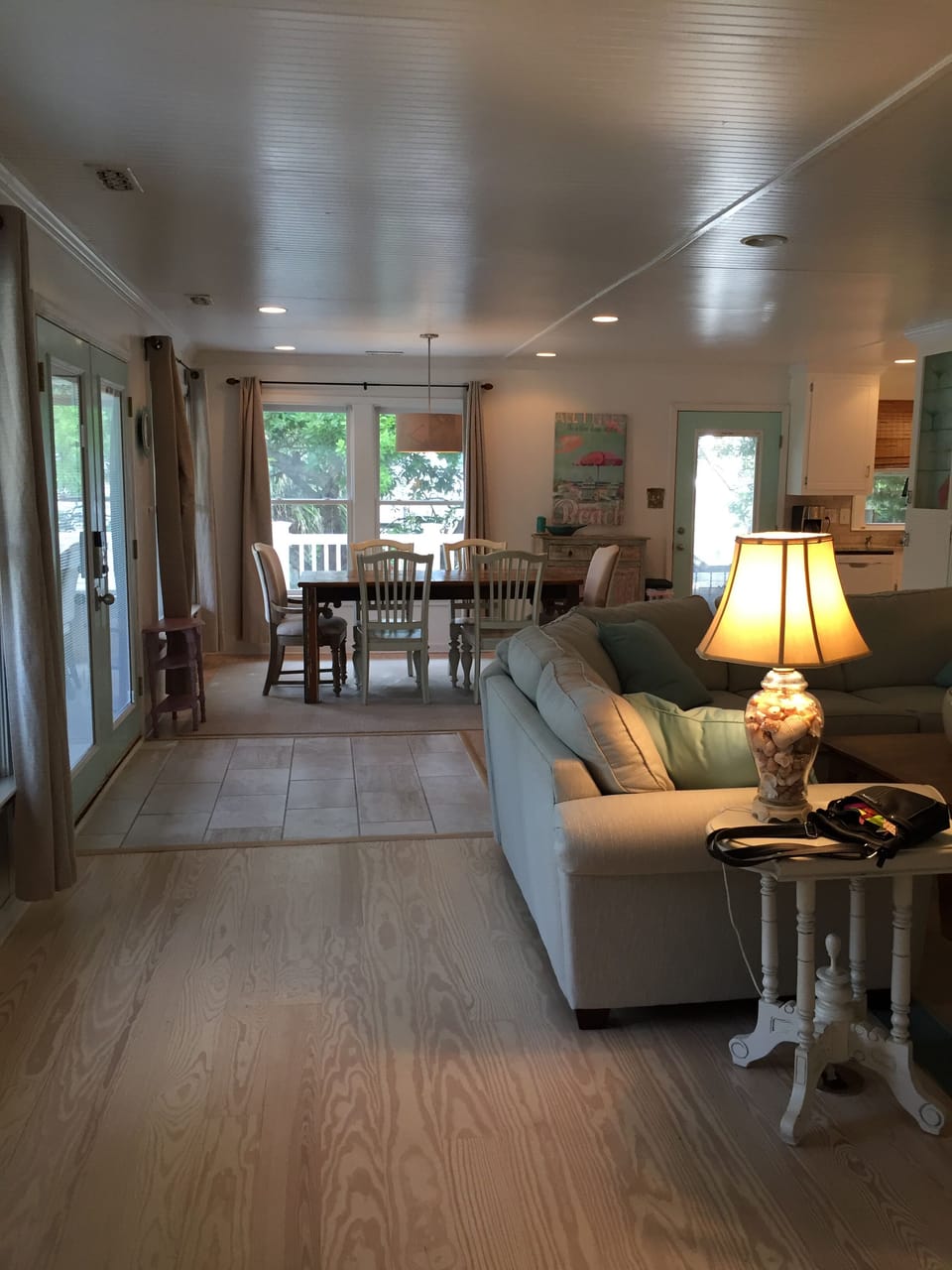 Open floor plan from sun room to dining area.