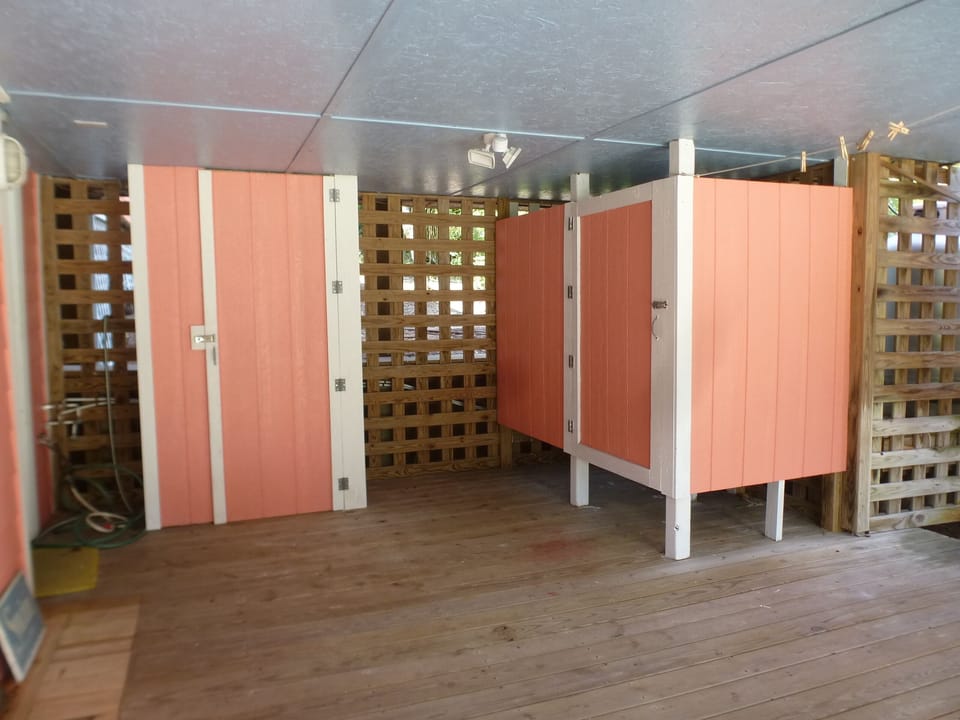 Outside shower and dressing area. Beach equipment storage for guests.