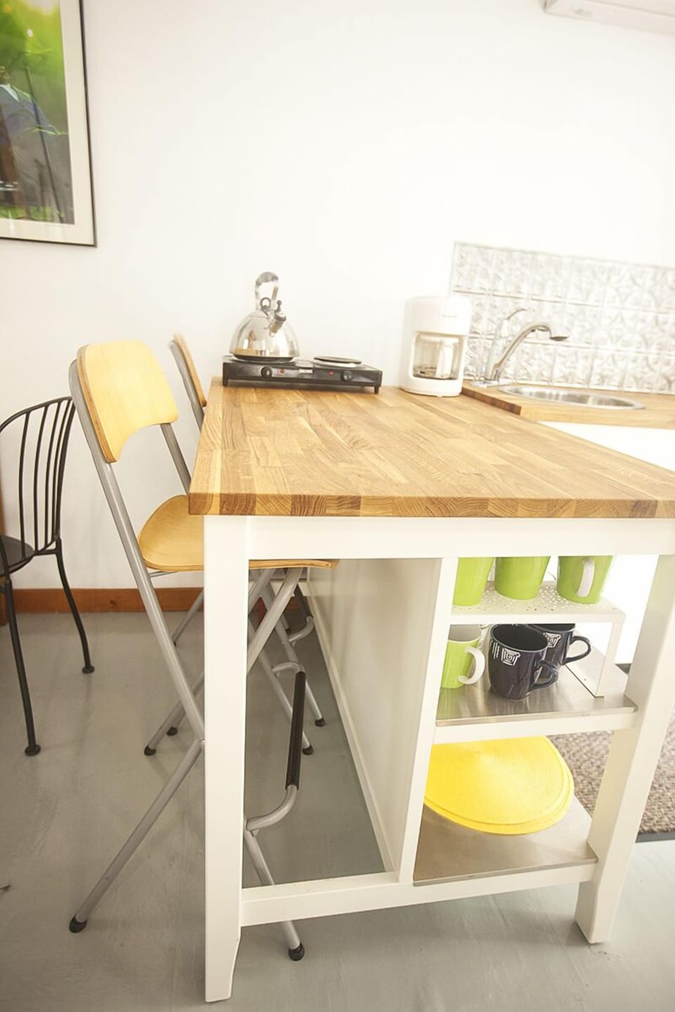 The bar height countertop can be used as a  a stand-up work space.