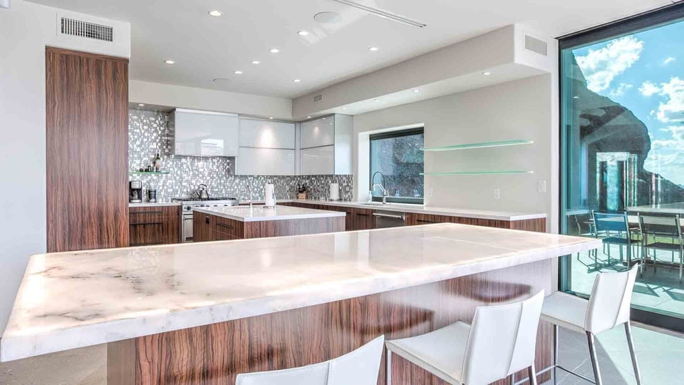 Second large island off the kitchen for dining w/ 4 bar stools