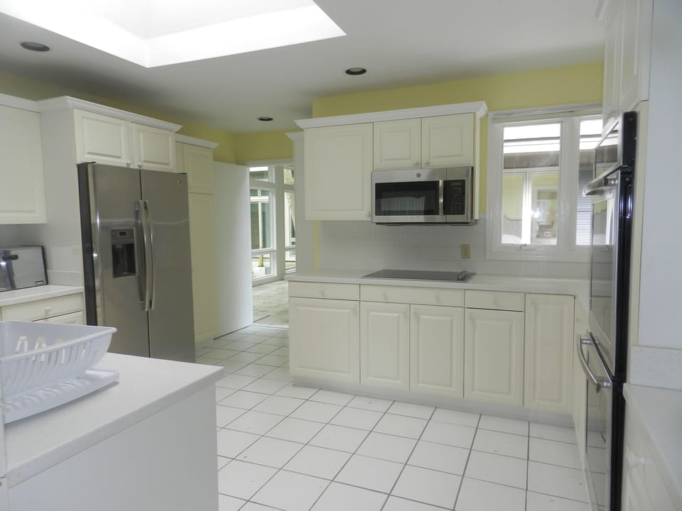 Microwave and side by side refrigerator with ice maker
