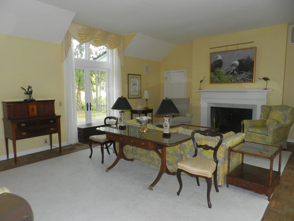 Living room with our eagle nest canvas. Sliders open to pool.