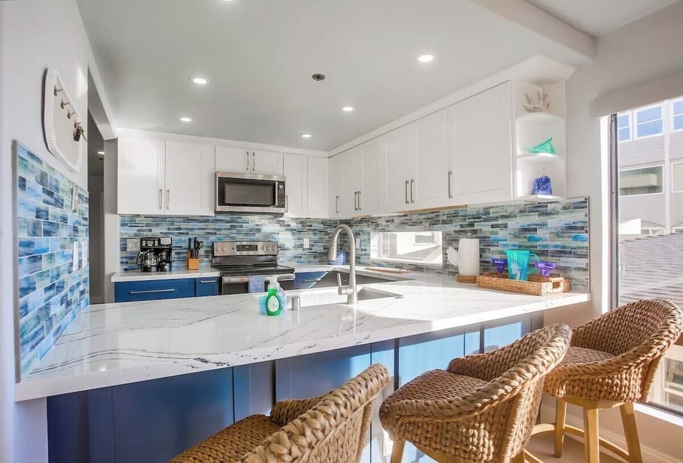 Completely renovated, gorgeous bright kitchen - fully equipped for meals at home! With 3 breakfast bar stools