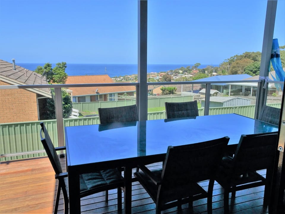 Outdoor dining on back balcony with views