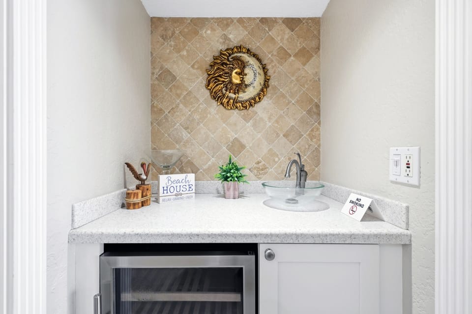 Wet bar with wine cooler.
