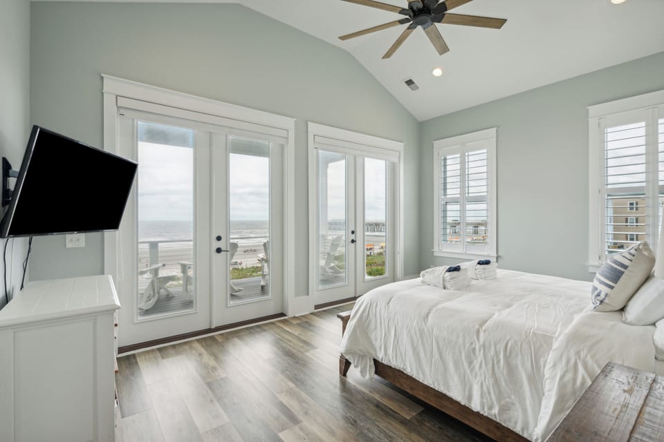 The main bedroom offers a King bed, smart tv and access to a beach front patio.