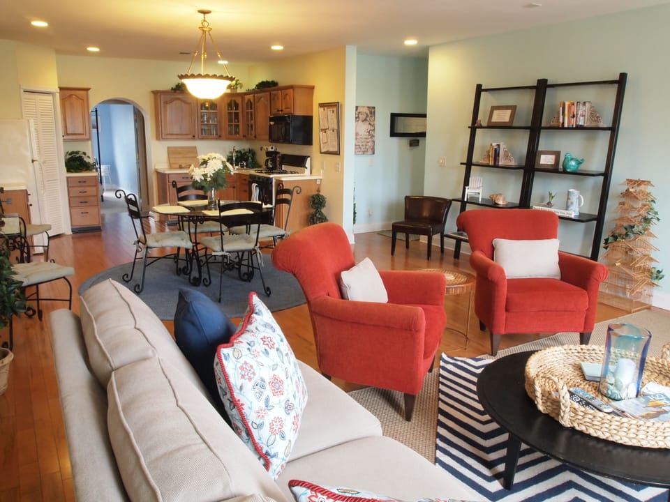 View of living room, dining area and kitchen