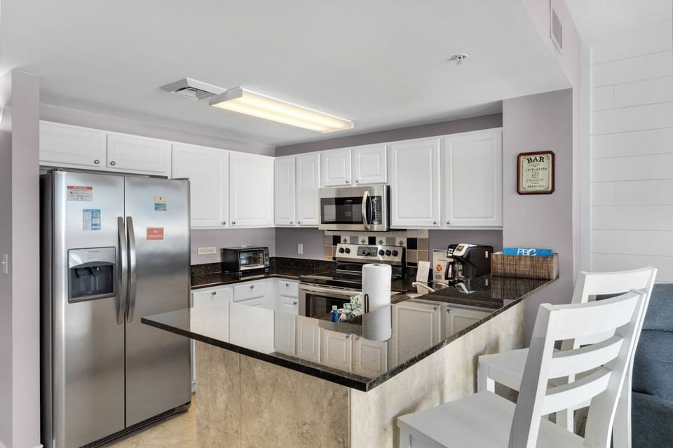Kitchen - Enjoy the art of cooking in this upscale kitchen with premium appliances, beautiful counters, and everything needed for exceptional meals.