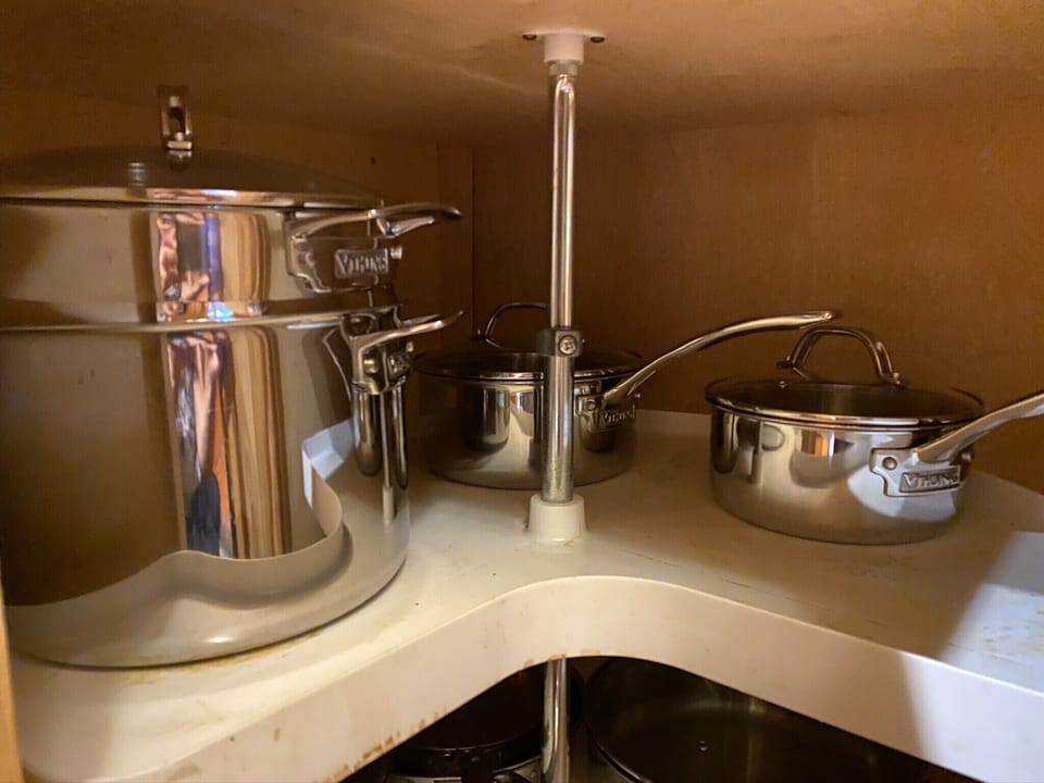 cleaned pots on the top shelf of corner cabinet (for renters)