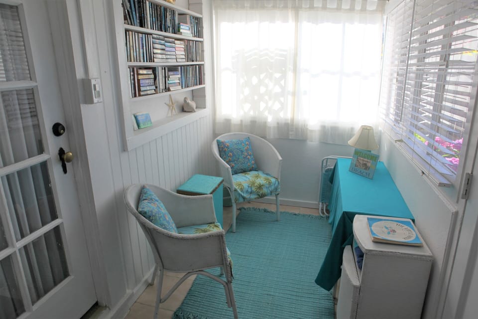 Side of porch room with living area door on left.