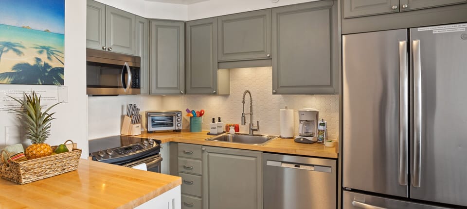 Butcherblock counters for a beachy feel. Hydroflasks and lots of cooking gear!