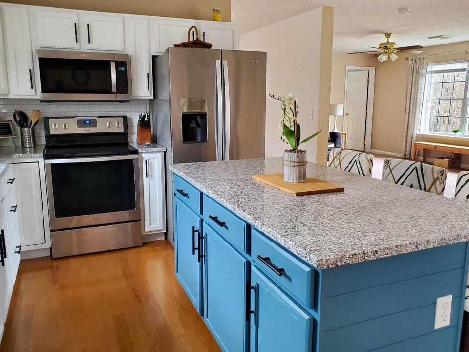 The heart of the home! Our open kitchen connects to both upstairs living rooms, so no one misses out on the fun