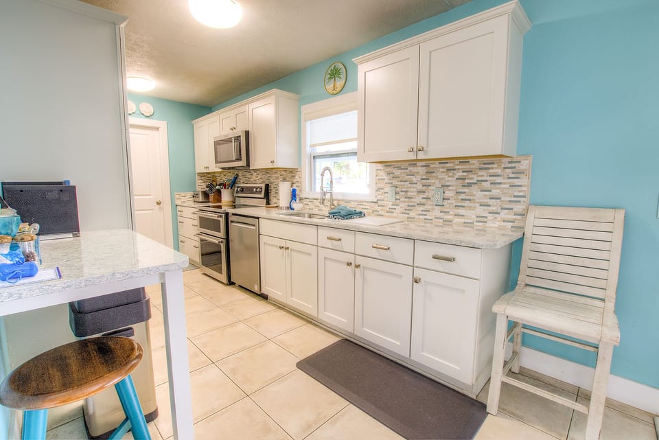 Beautiful well stocked kitchen with quality stainless appliances.