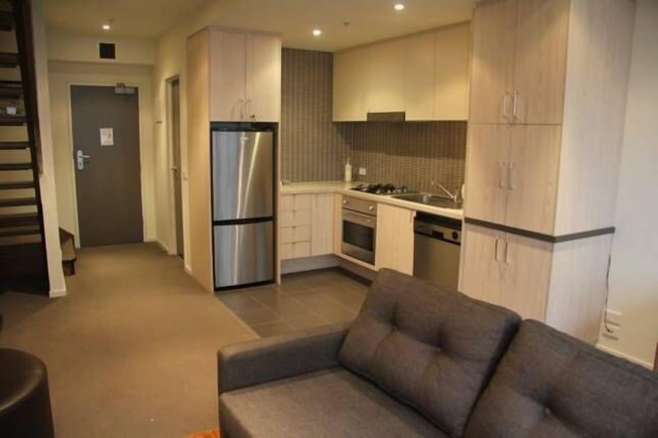 Full size fridge, open plan kitchen including a dishwasher