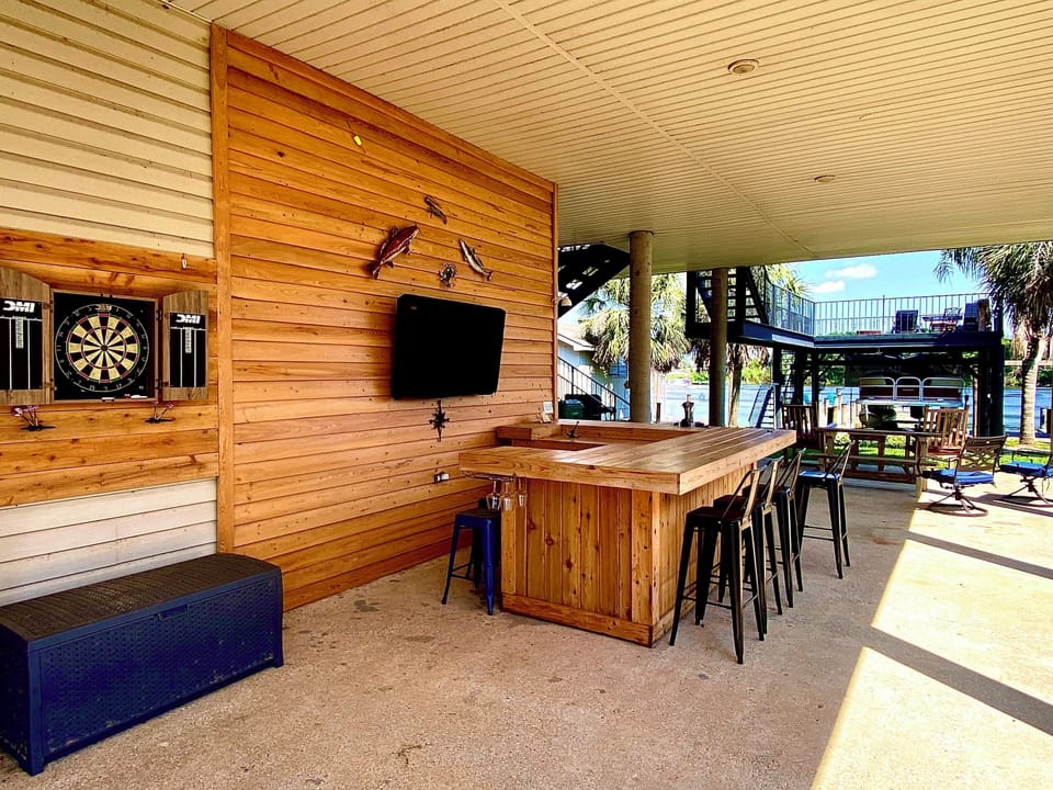 Cypress bar adds so much to enjoy outside...watch football, a movie, darts....