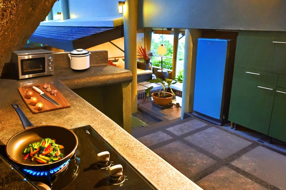 Tropical style kitchen. Gas hob, microwave, toaster, kettle, rice cooker, etc 