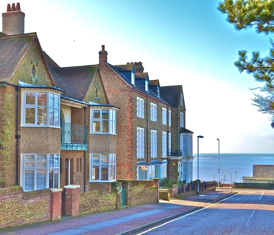 Front of house (1st on left), looking down towards the sea.