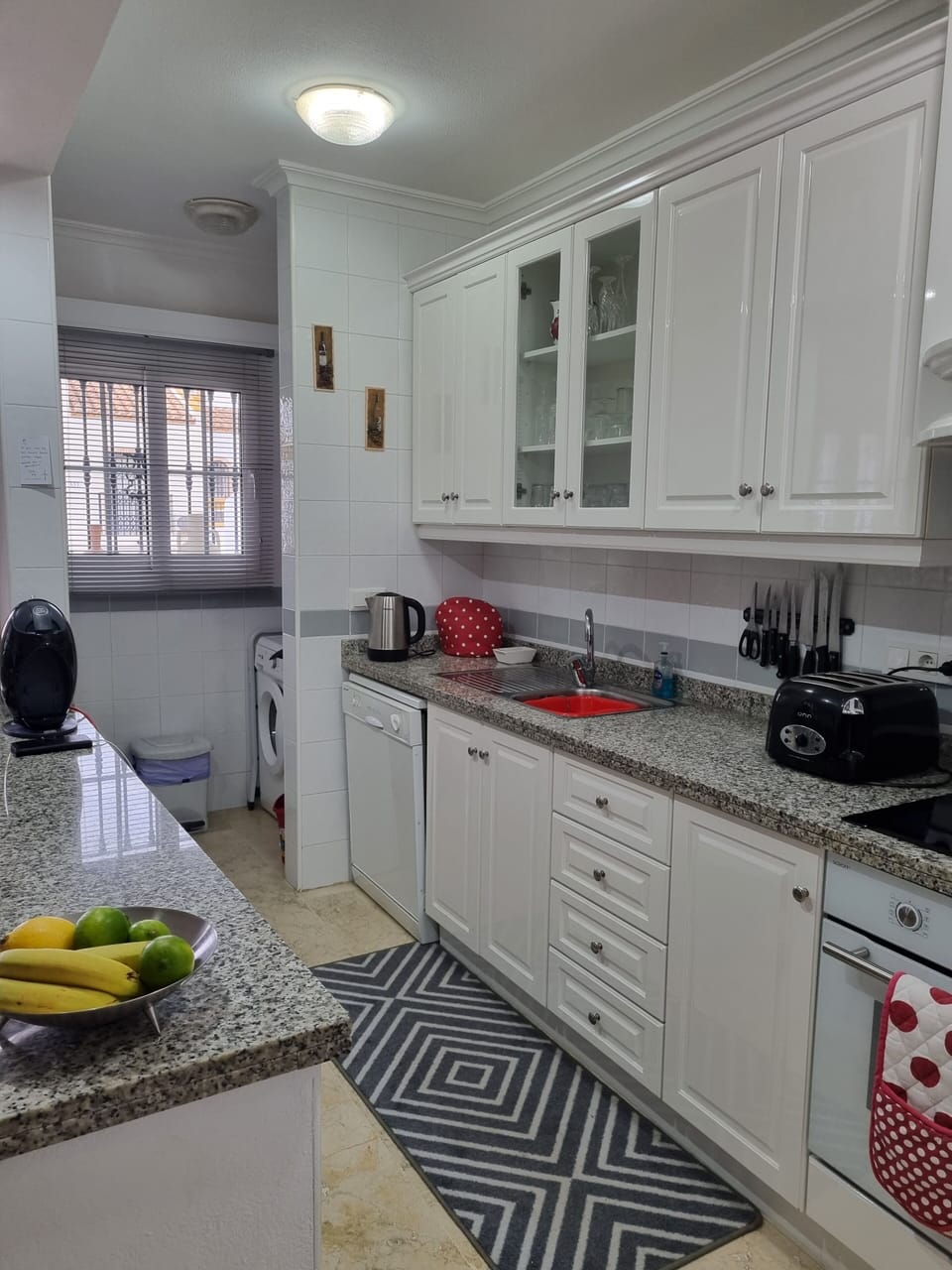 Kitchen showing Utility area and full size dishwasher