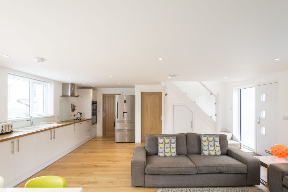 Kitchen with wooden work tops and big family fridge