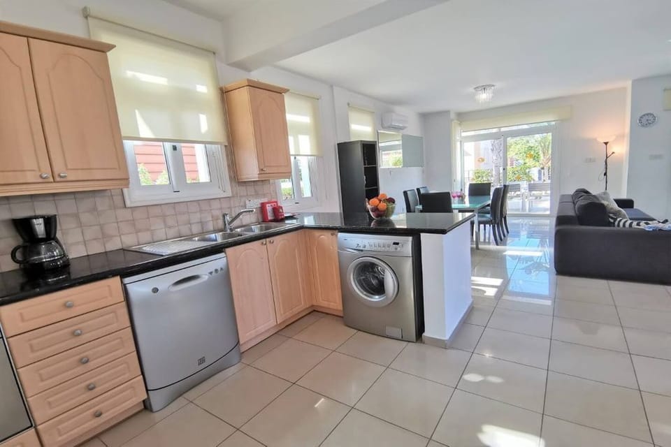 private kitchen with dishwasher and washing machine.