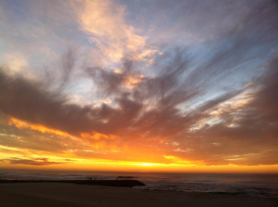 Watch the sun melt into the ocean, just steps away....