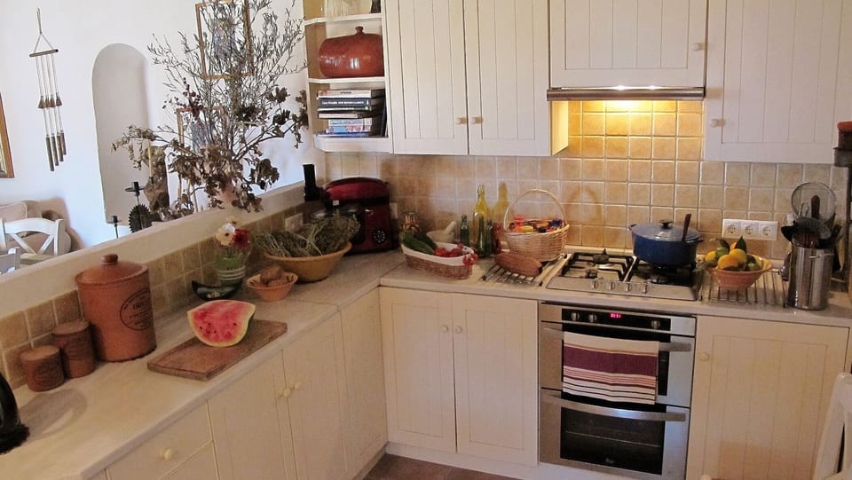 Half the Kitchen (well equipped). Fresh herbs on the terrace.