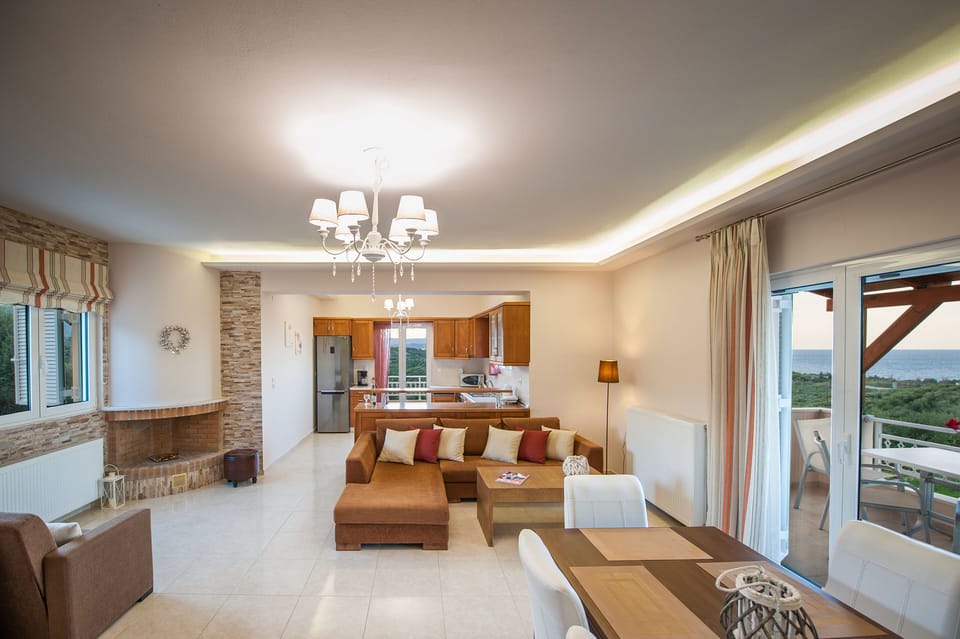 Open plan area boasting a dining area, living room and kitchen!