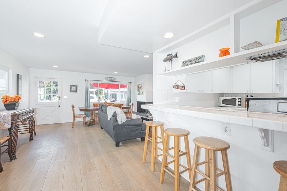 Bar stools line the breakfast counter, making meal prep a social affair!
                