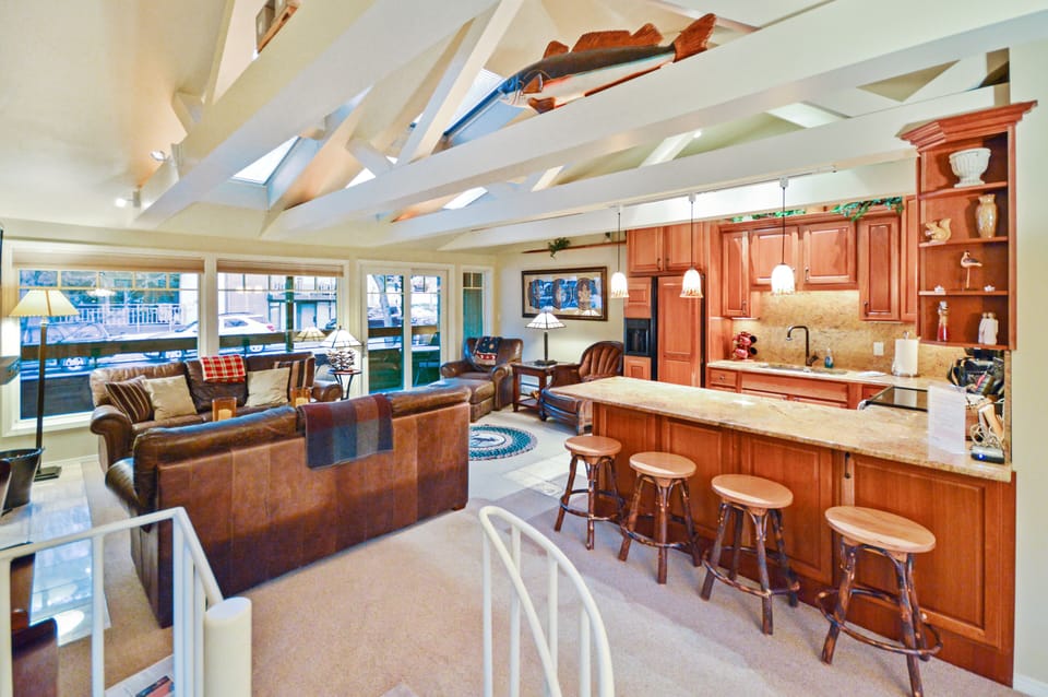 The spacious living area features high ceilings and skylights