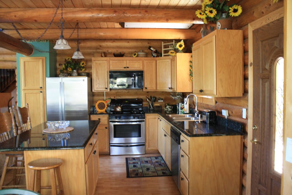 Kitchen with island, opens to the living room and dinning area.