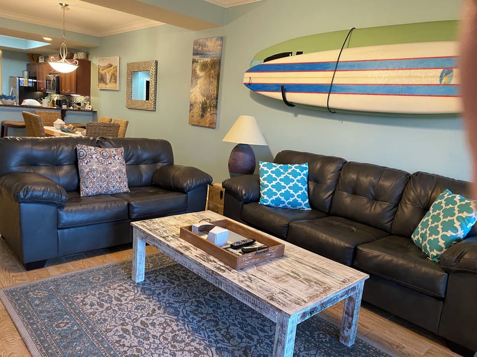 Relaxation Sofa Zone: next to sliding glass doors to balcony/patio area.