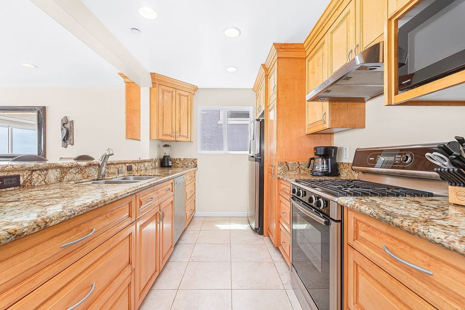 The kitchen looks out onto the main living and dining area, making meal prep a social affair!
                
