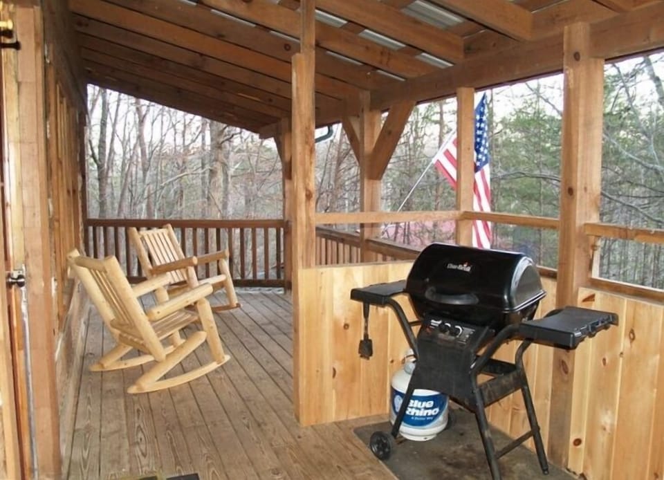 Wrap around Deck with Rockers and Gas grill.... God Bless our Troops