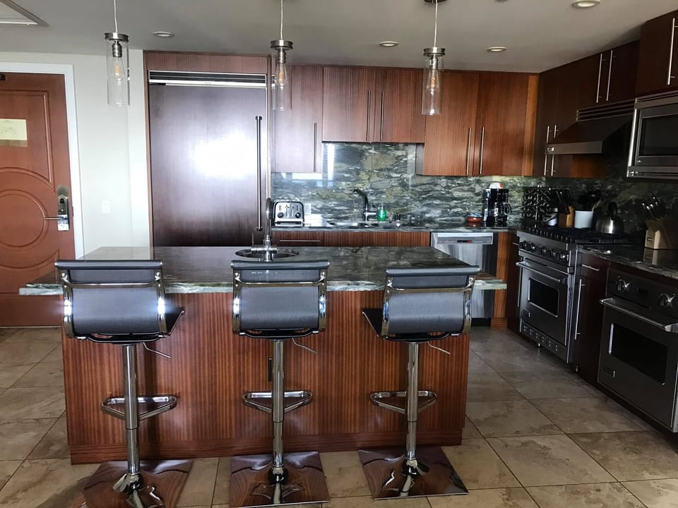 Kitchen Island with modern bar stools and modern pendant lighting.