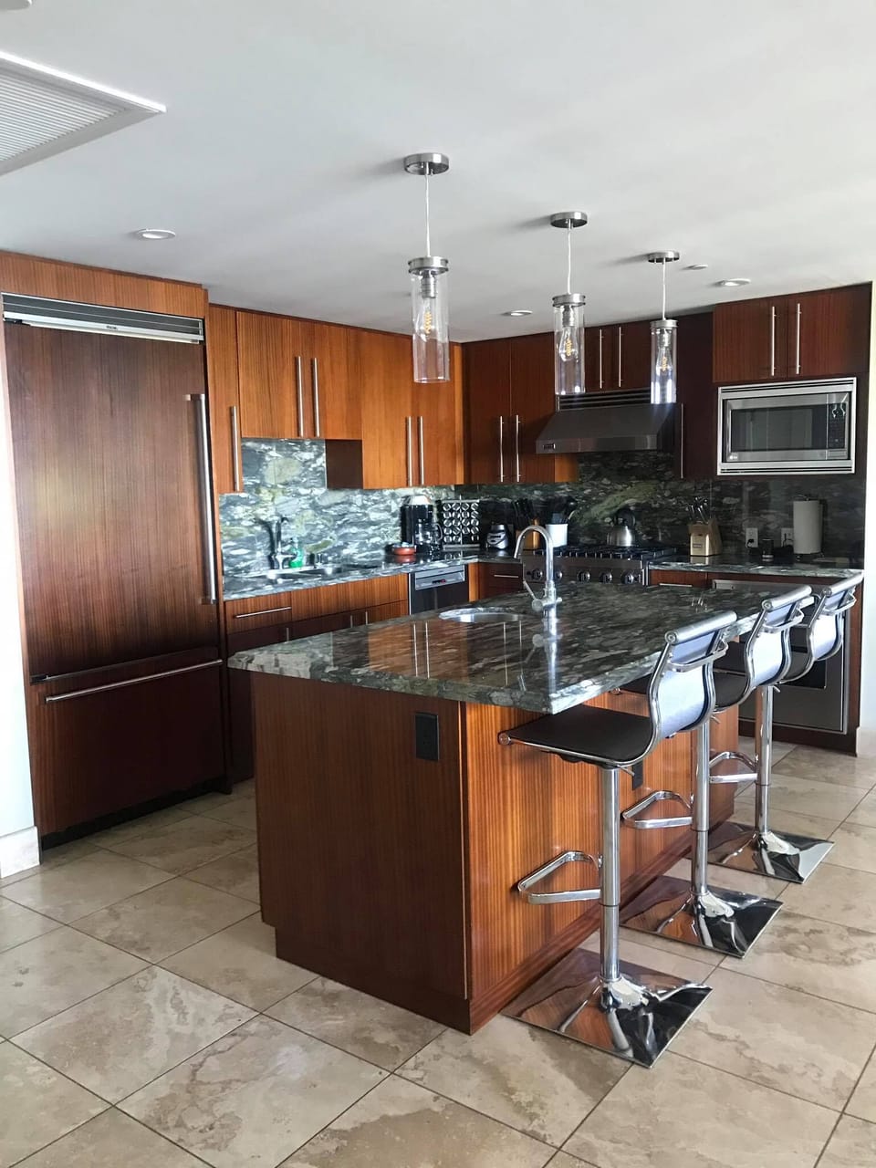 Kitchen Island with modern bar stools and modern pendant lighting