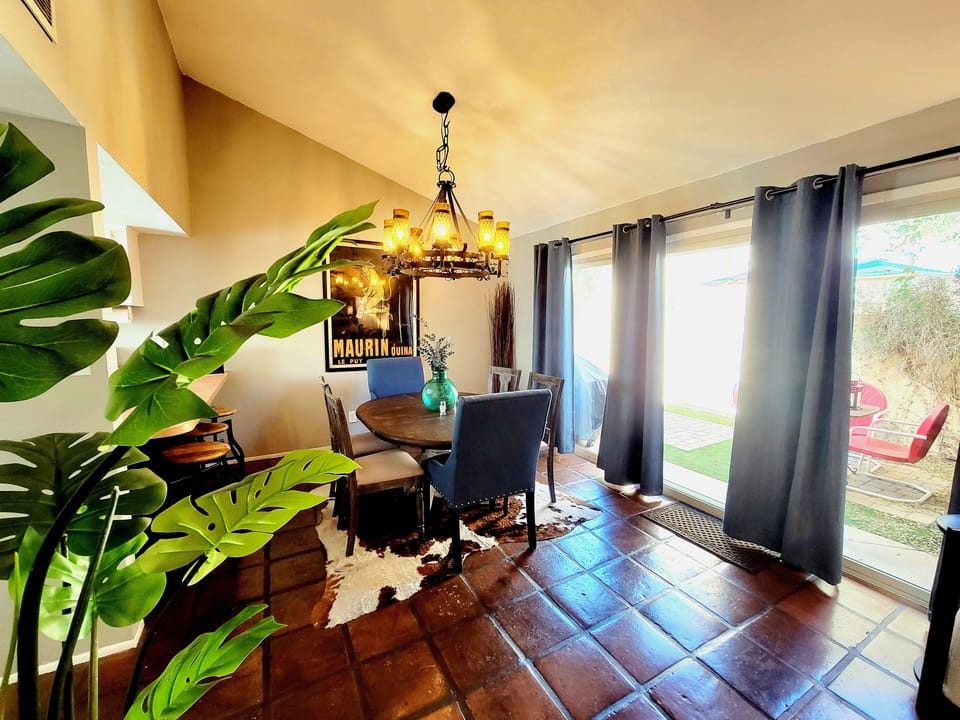 Entrance into living space with wall of windows to the outdoor space beyond.