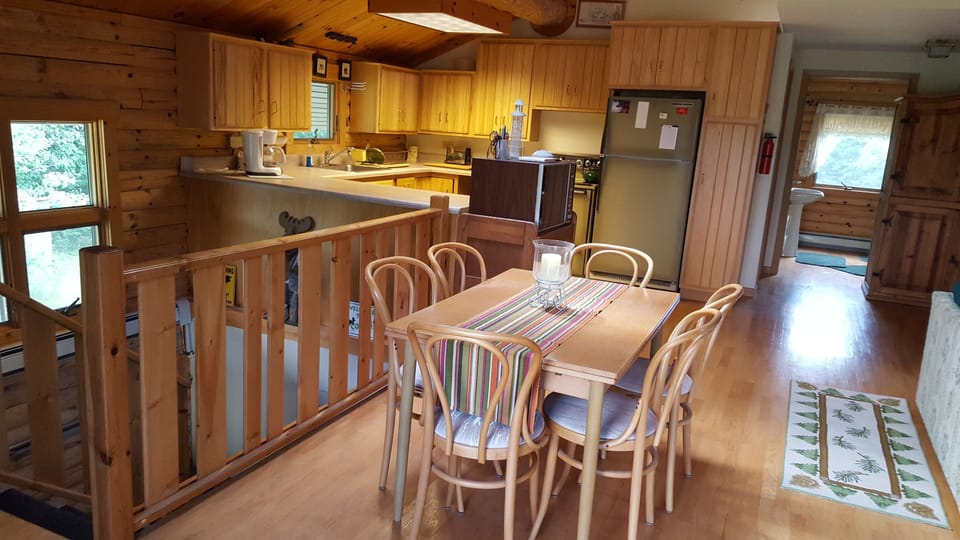 Dining area with Kitchen in the background.
