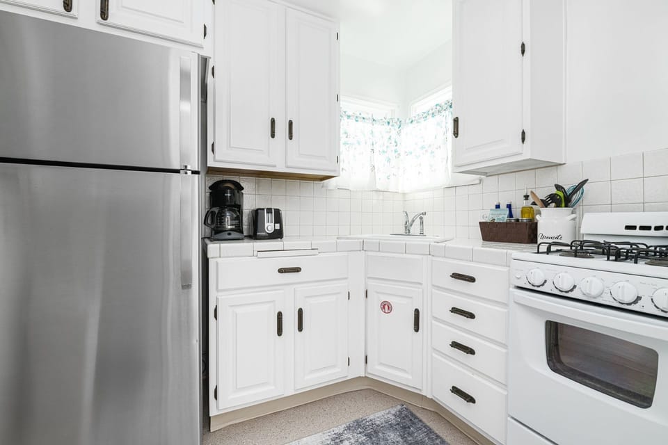 The kitchen comes stocked with dishes, utensils, cookware, bakeware, and large/small appliances.
                