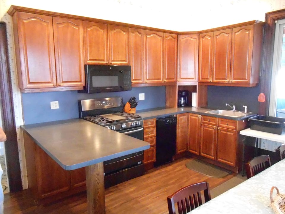 Kitchen  /island countertop / dining table, Gas Range, Refrigerator /dishwasher 