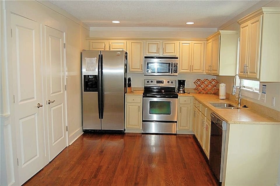One of TWO large kitchens furnished with all the amenities & spacious pantries