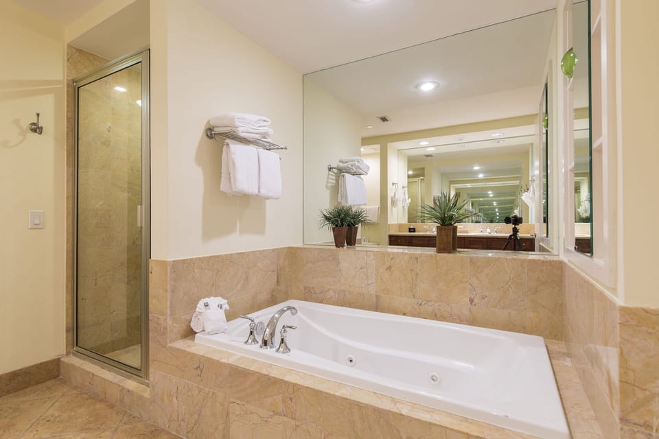 A spa-inspired primary bath designed for relaxing after beach days.