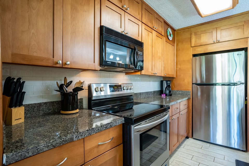 Fully stocked kitchen inside refrigerator purified water dispenser.