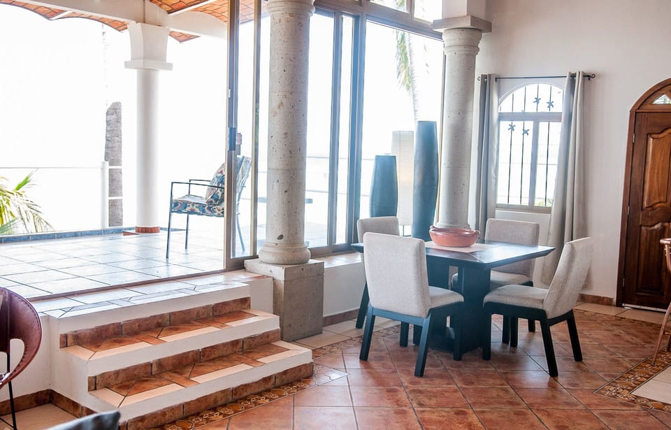 Open concept dining steps from the entertaining kitchen and expansive deck. 