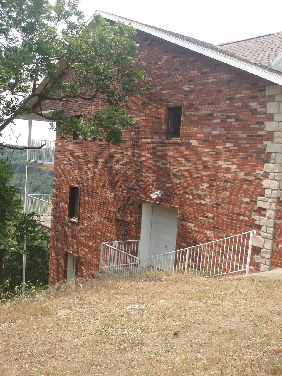 Side view of house. Three story but top two fro rent.